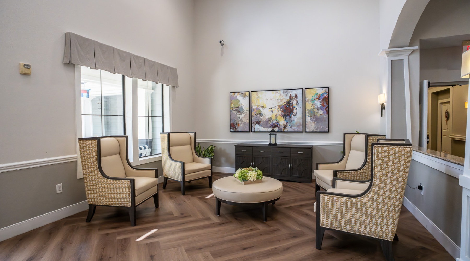 seating area with a table next to windows