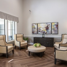 Settle into comfort at Buffalo Creek seating area with a table next to windows