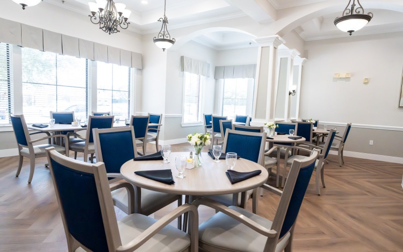 a dining room with seating and tables