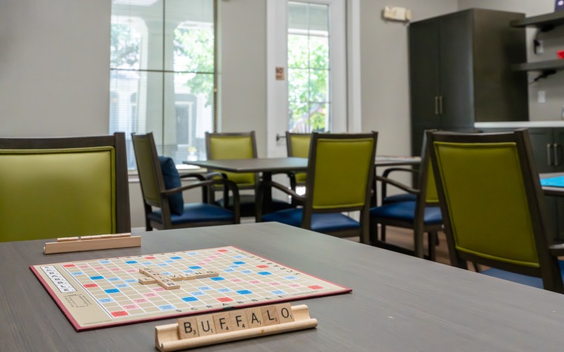 a table with seating with a scrabble board table