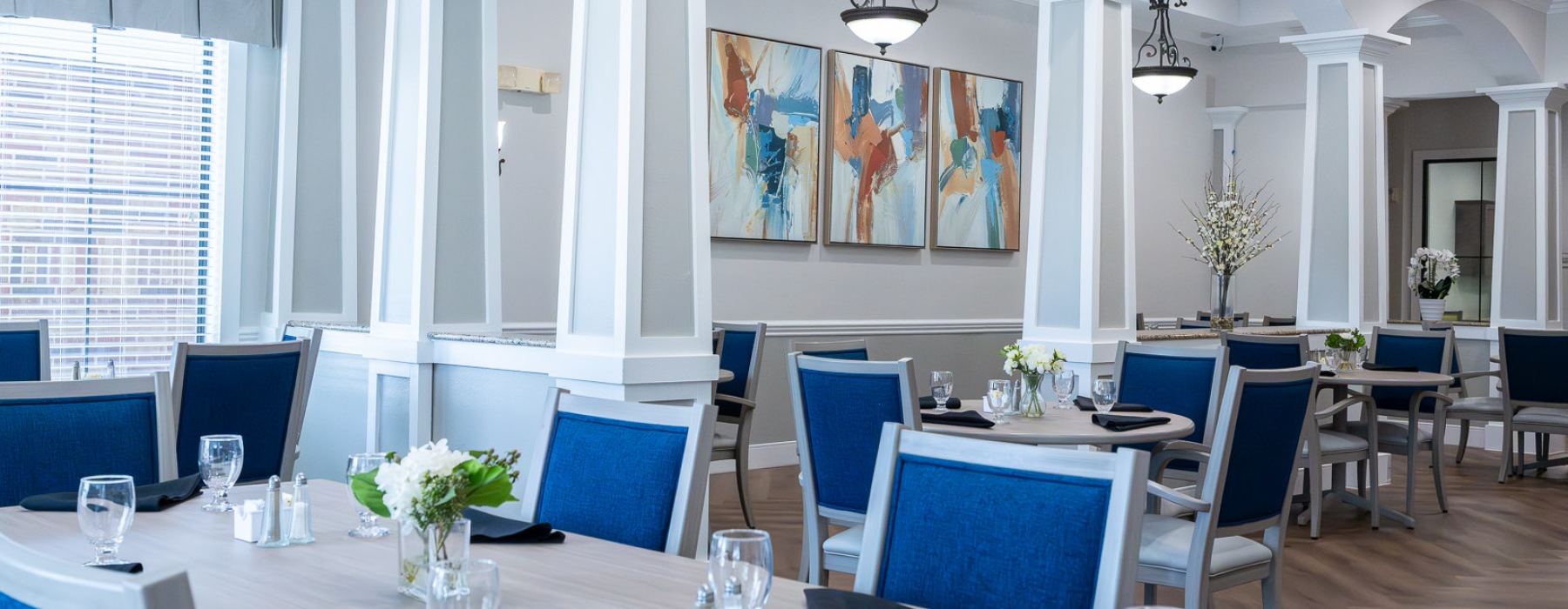 a dining room with seating and tables