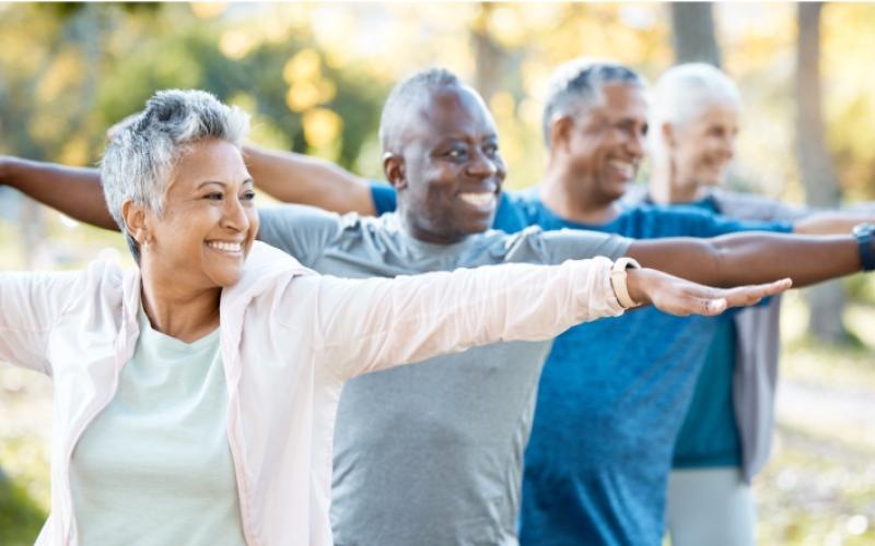 a group of people stretching outside