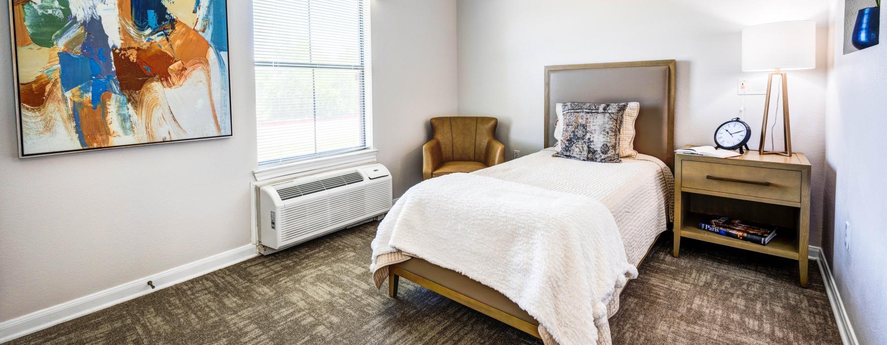 bright, carpeted bedroom